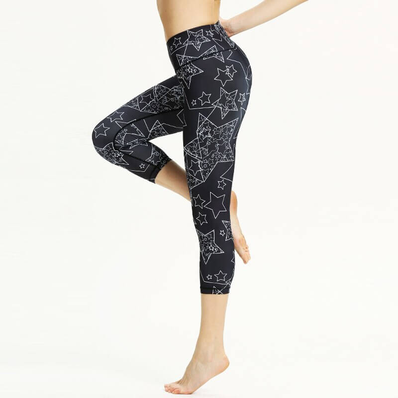 Women's high waist floral sports leggings in capri style, perfect for yoga, running, and fitness with breathable fabric and elastic waistband.